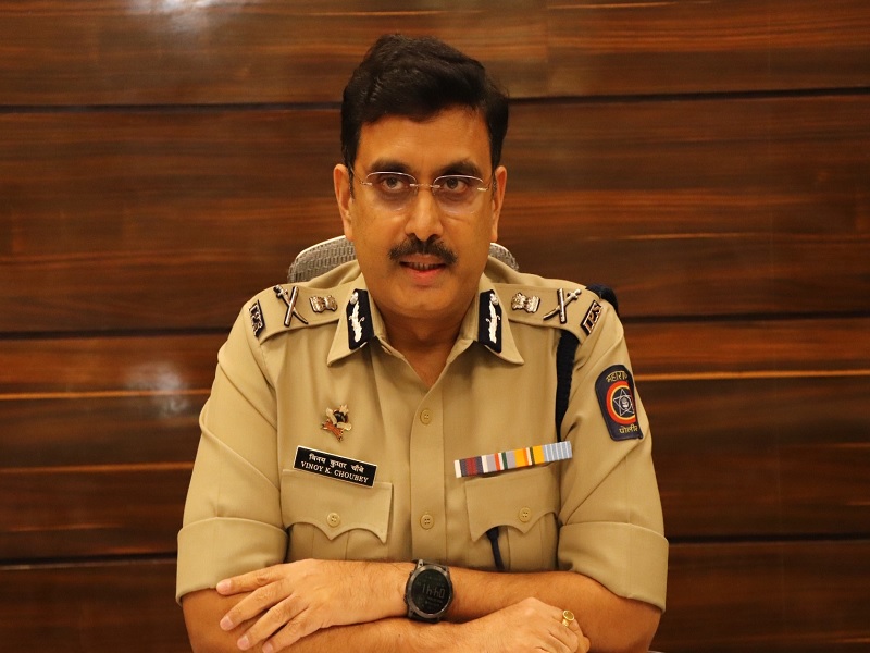 Official portrait of Vinoy Kumar Choubey, IPS, seated in service uniform with his name plate visible.