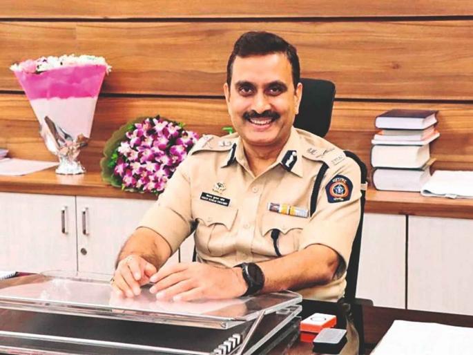 Vinoy Kumar Choubey at his office desk in service uniform.